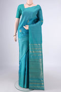 Pure Silk Turquoise Dual Tone Kanjivaram Saree with Zari Butta on the body and Without Border.  displayed on a mannequin