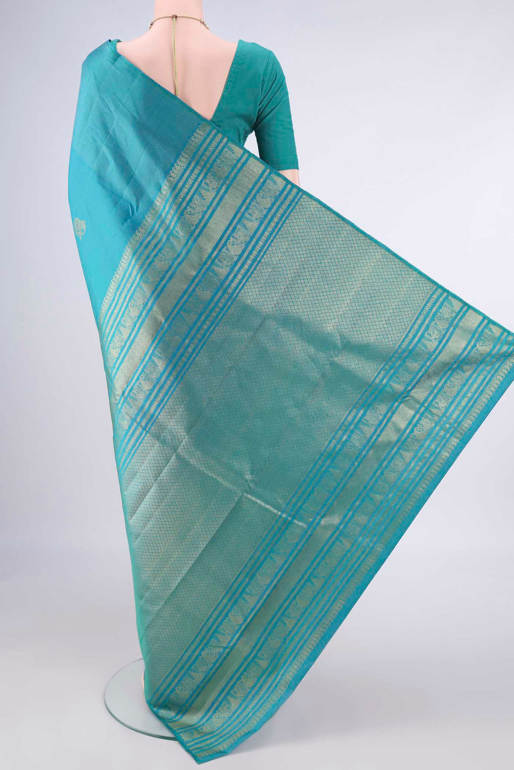 Flat view of Pure Silk Turquoise Dual Tone Kanjivaram Saree with Zari Butta on the body and Without Border. 