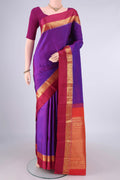 Pure Silk Purple Kanchipuram Saree with Plain Body and Zari And Thread Border.  displayed on a mannequin