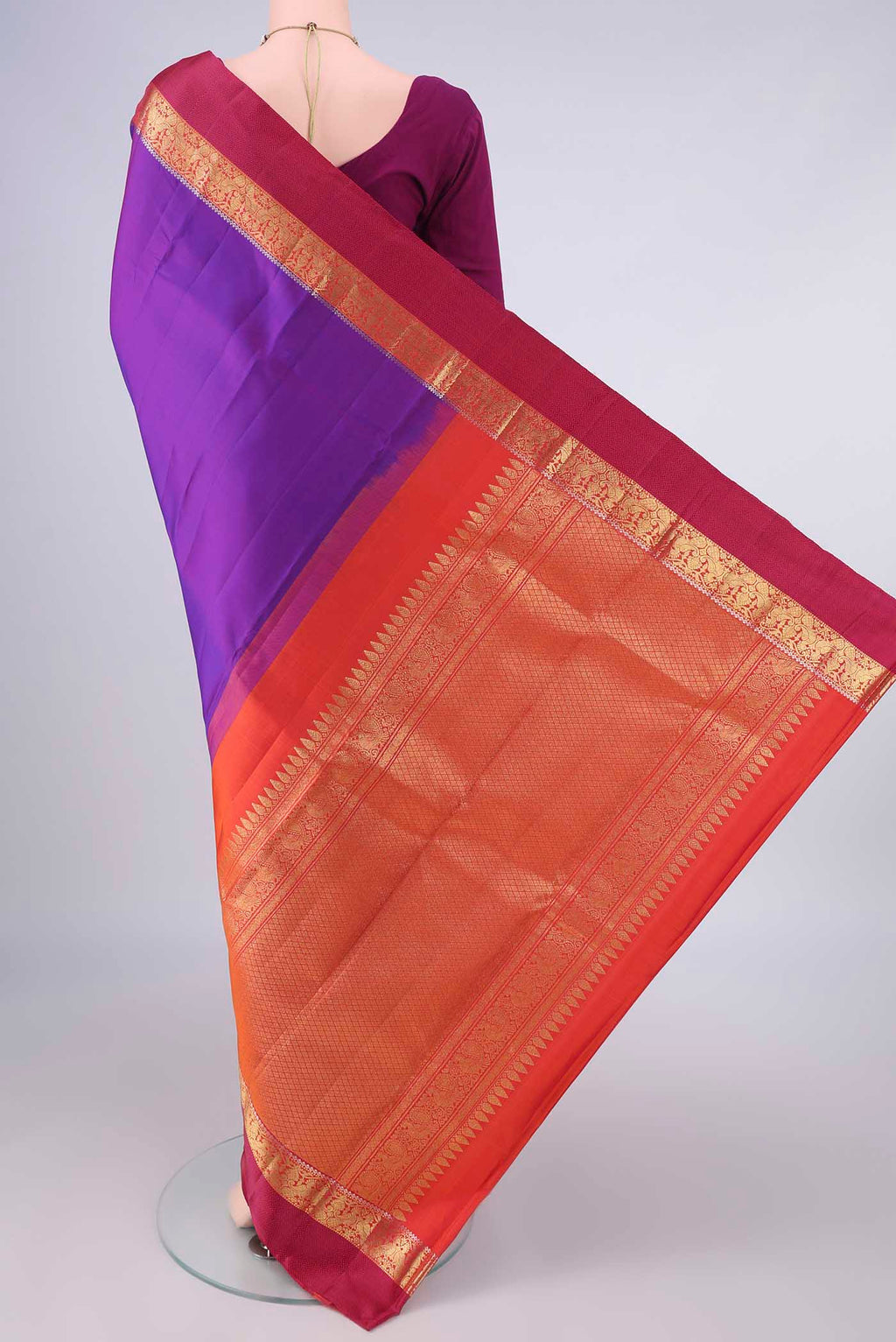 Flat view of Pure Silk Purple Kanchipuram Saree with Plain Body and Zari And Thread Border. 