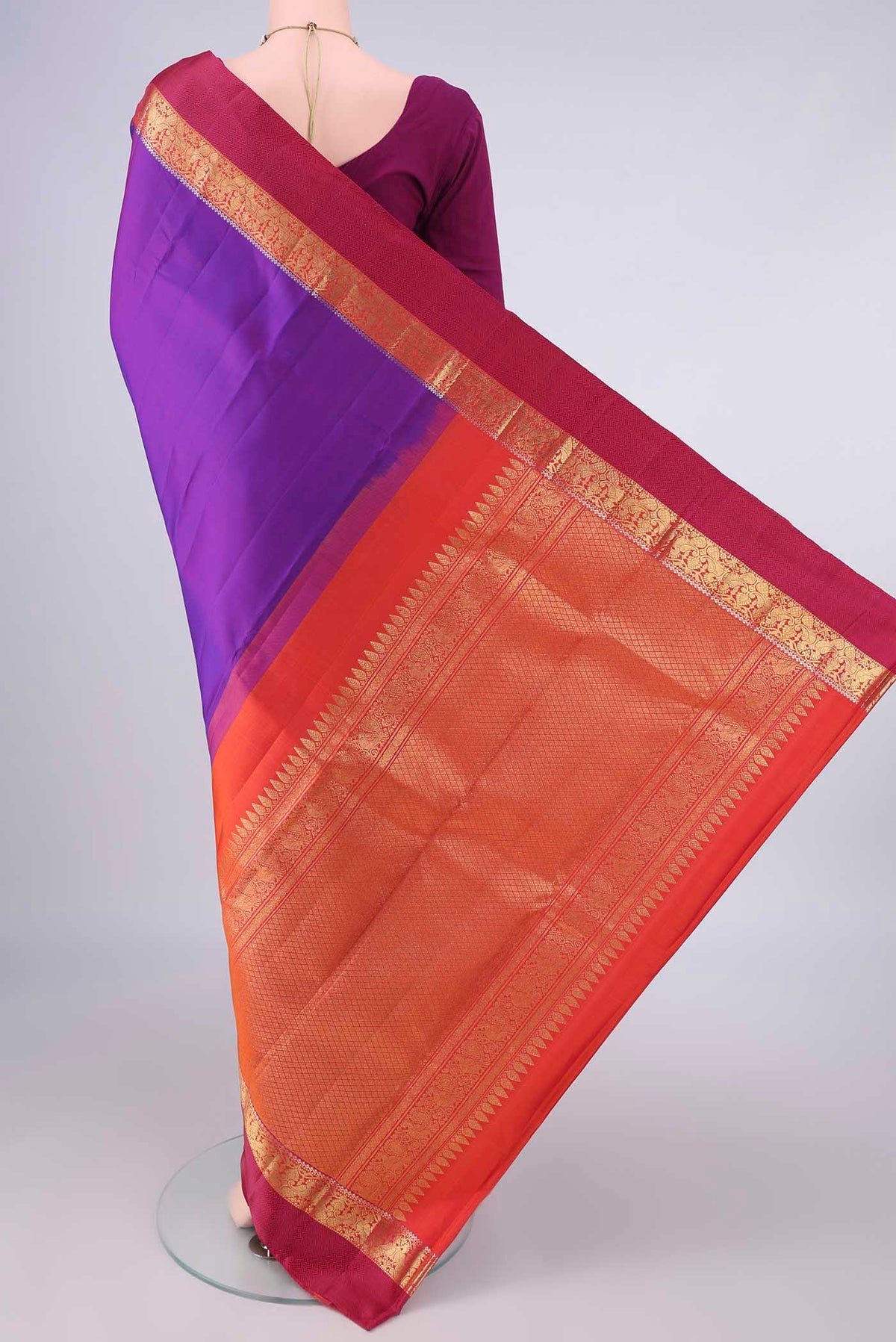 Flat view of Pure Silk Purple Kanchipuram Saree with Plain Body and Zari And Thread Border. 