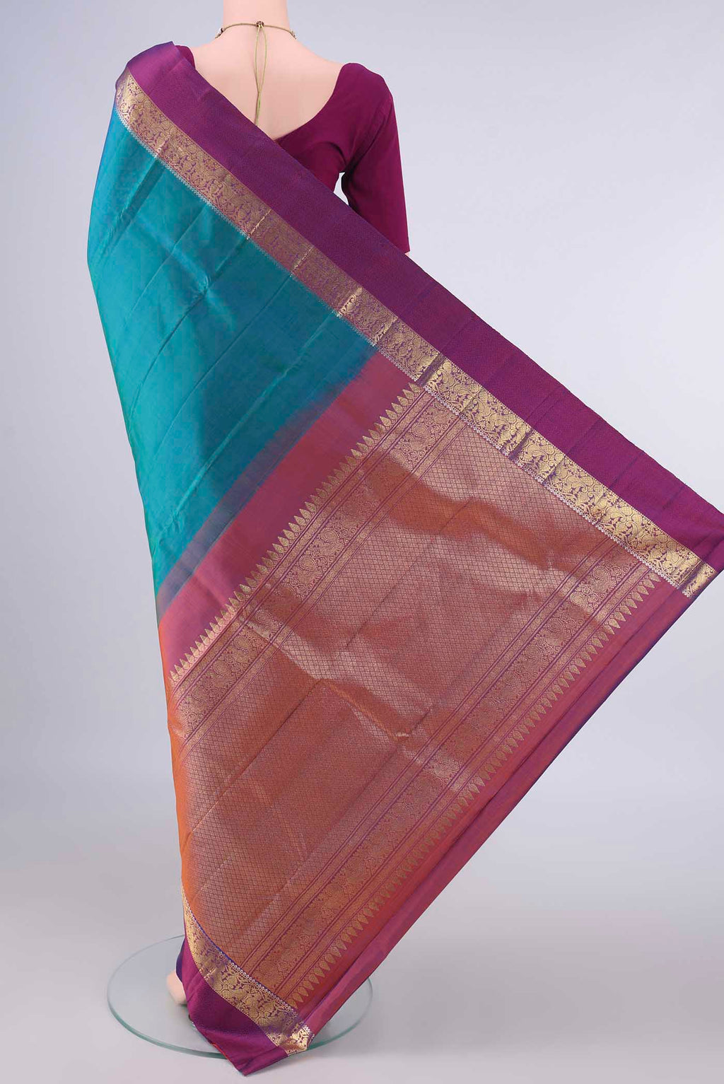 Flat view of Pure Silk Sea Green Kanchipuram Saree with Plain Body and Zari And Thread Border. 