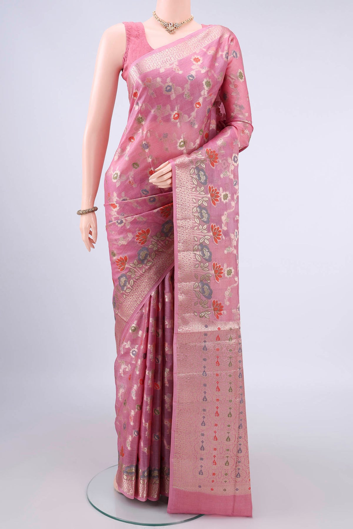 Pink Banarasi Tussar Saree with Zari And Thread Butta on the body and Zari Border.  displayed on a mannequin