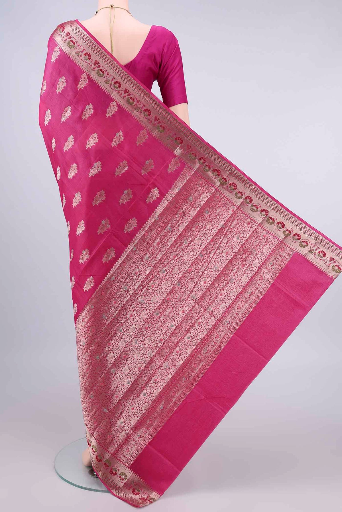 Flat view of Rani Pink Banarasi Tussar Saree with Zari And Thread Butta on the body and Zari Border. 