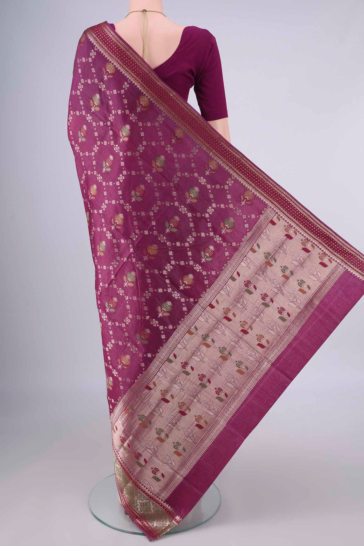 Flat view of Magenta Banarasi Tussar Saree with Zari And Thread Butta on the body and Zari Border. 