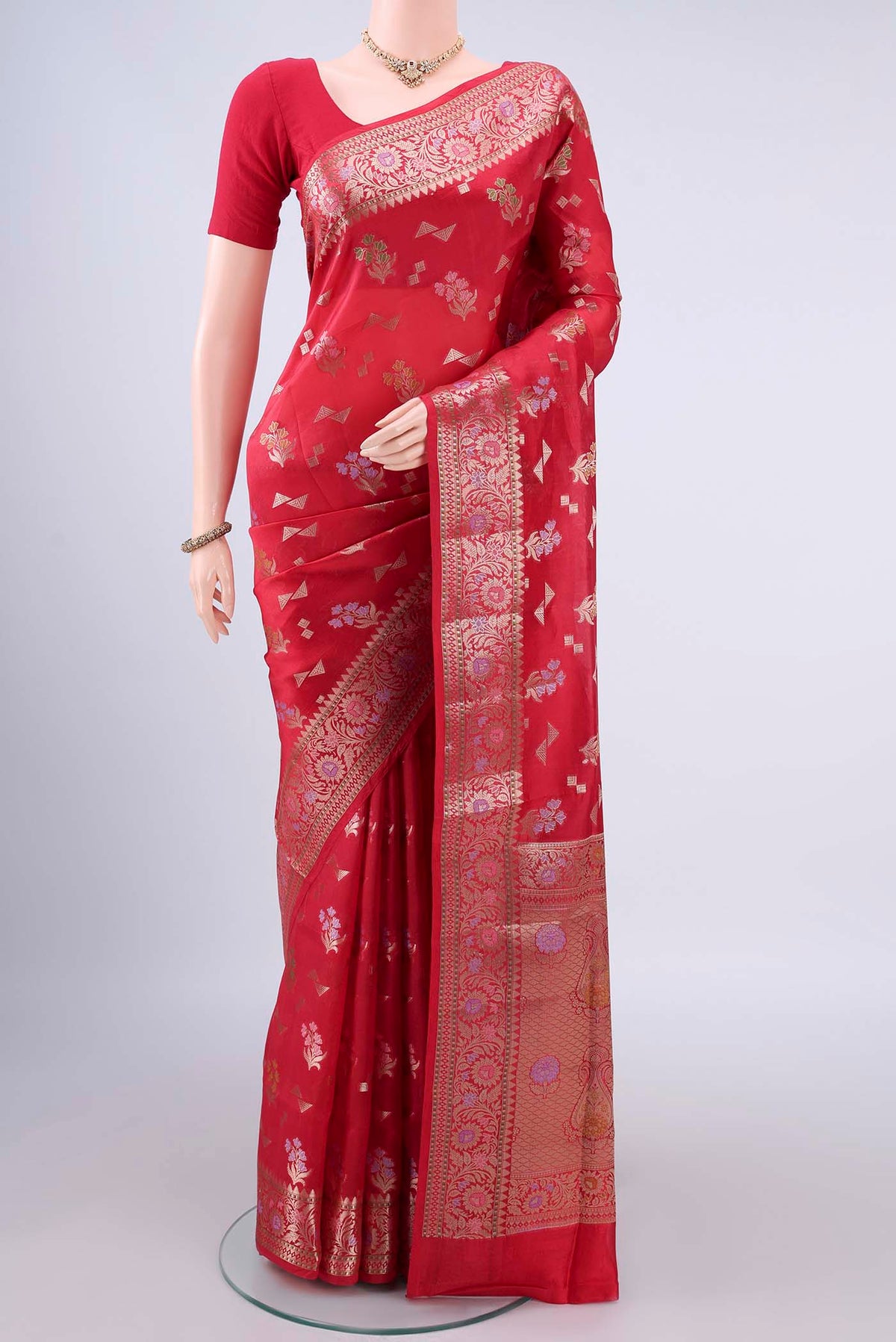 Pure Silk Red Banarasi Raw Saree with Zari And Thread Butta on the body and Zari Border.  displayed on a mannequin