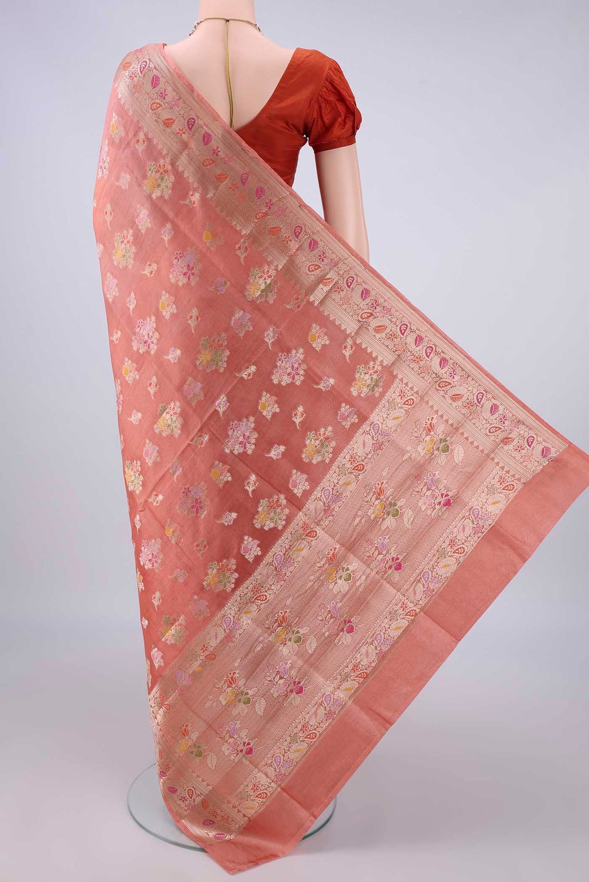 Flat view of Pure Silk Peach Banarasi Raw Saree with Zari And Thread Butta on the body and Zari And Thread Border. 