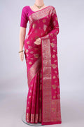 Pure Silk Rani Pink Banarasi Raw Saree with Zari And Thread Butta on the body and Zari And Thread Border.  displayed on a mannequin