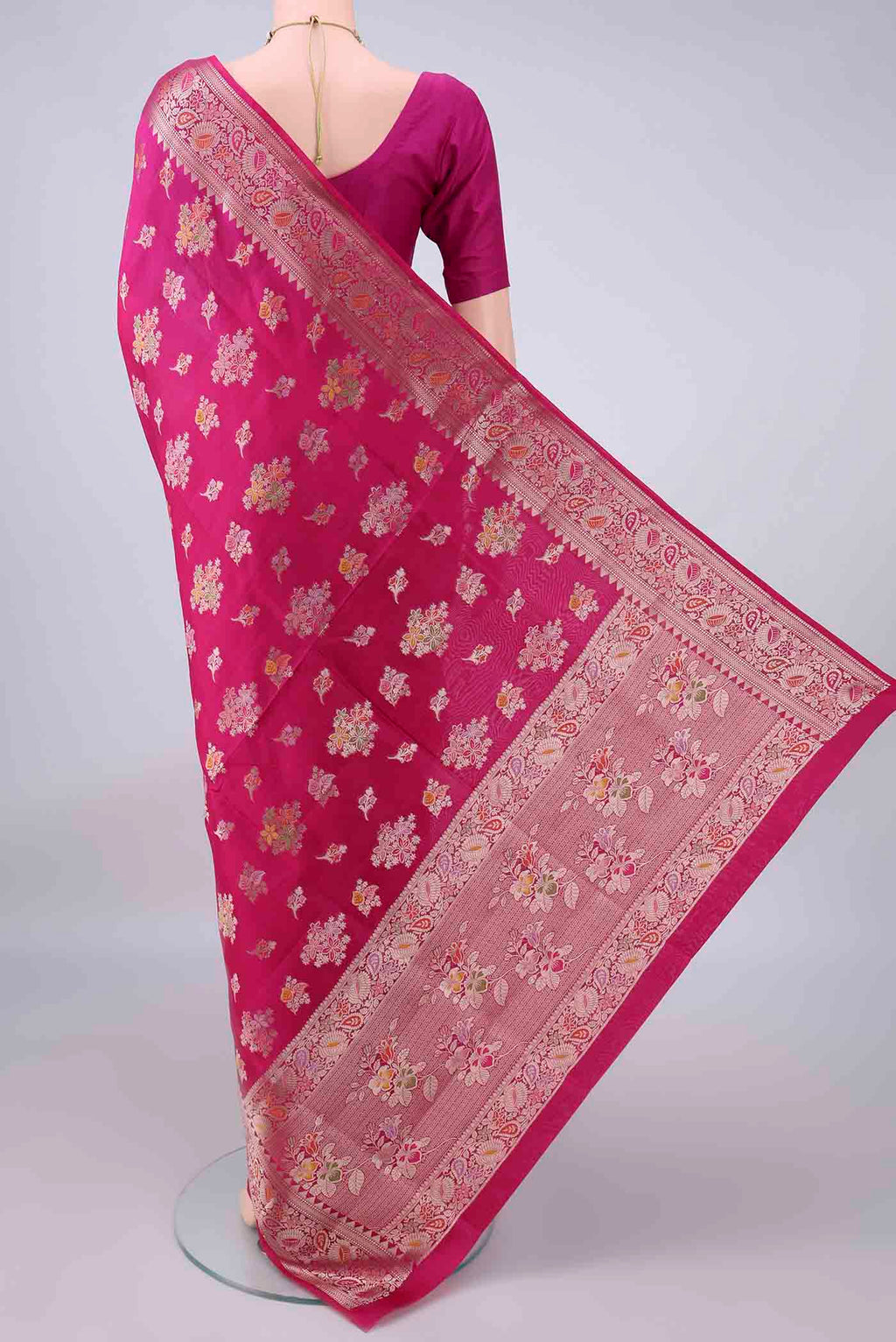 Flat view of Pure Silk Rani Pink Banarasi Raw Saree with Zari And Thread Butta on the body and Zari And Thread Border. 