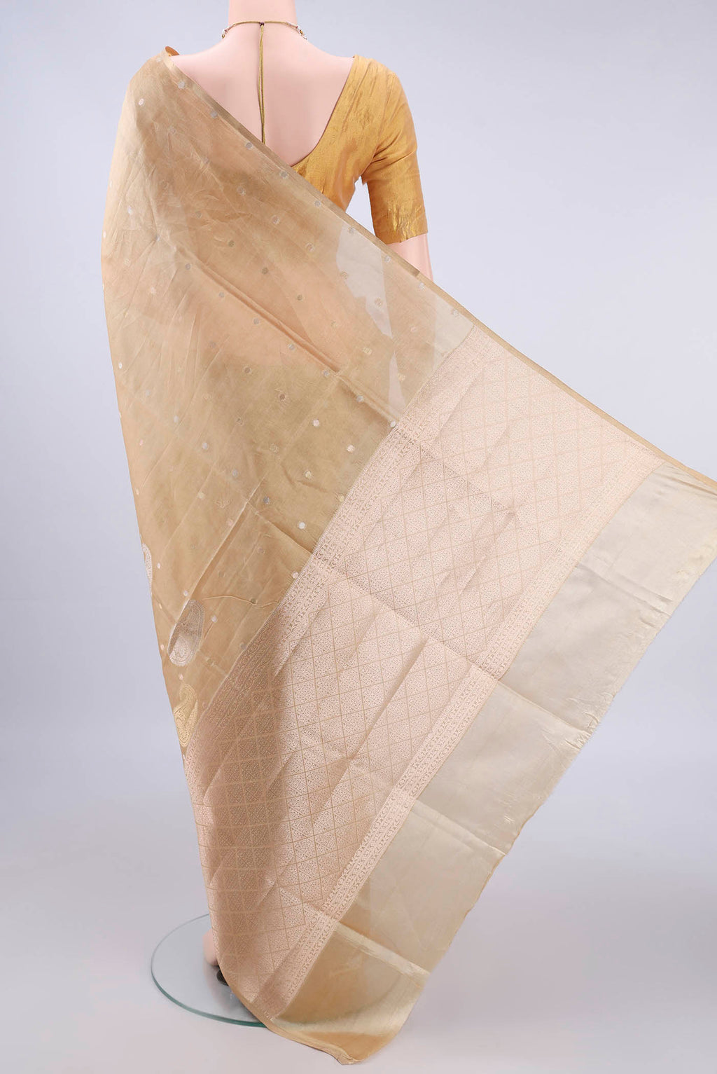 Flat view of Pure Silk Sandal Banarasi Raw Saree with Zari And Thread Butta on the body and Without Border. 
