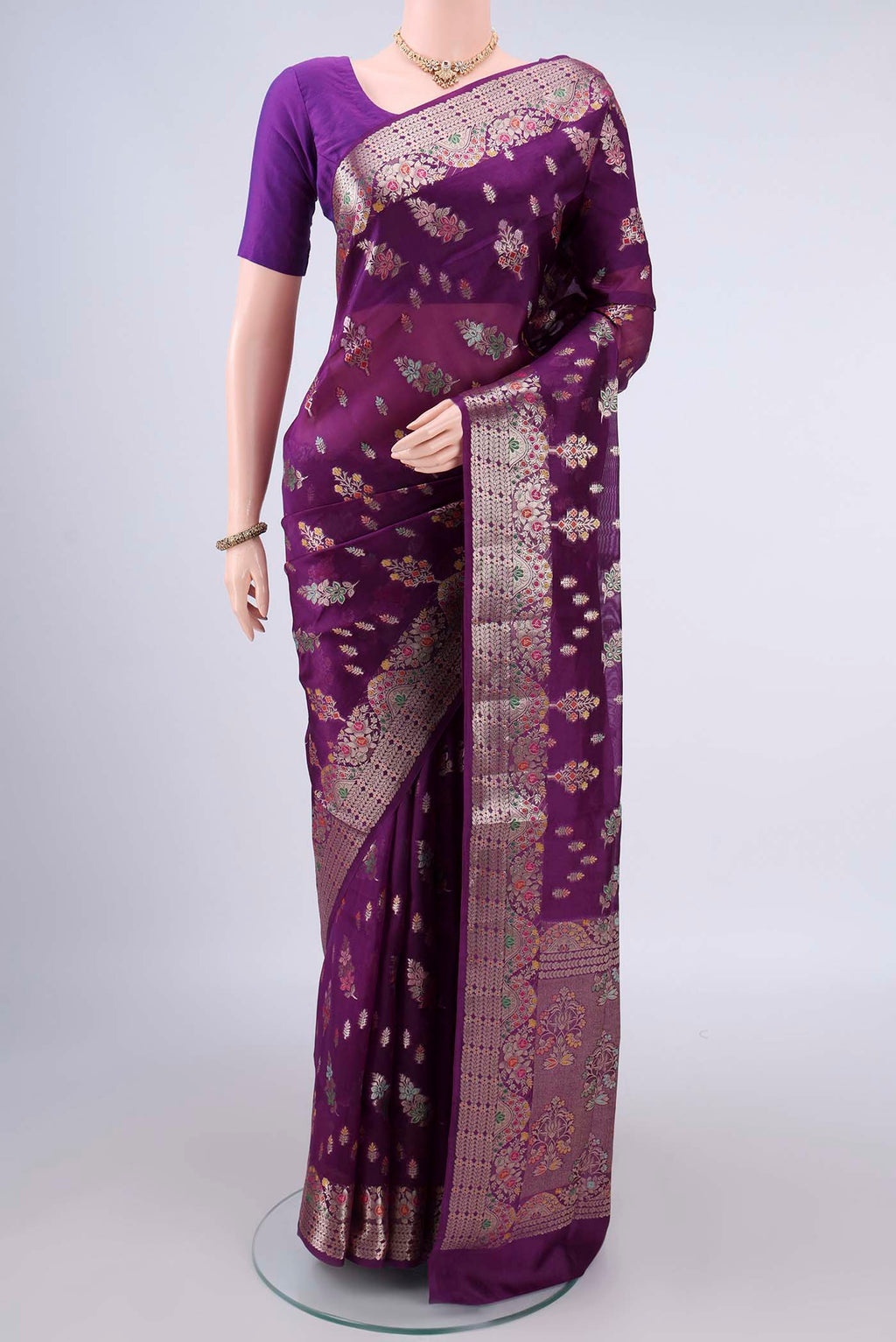 Pure Silk Purple Banarasi Raw Saree with Zari And Thread Butta on the body and Zari Border.  displayed on a mannequin
