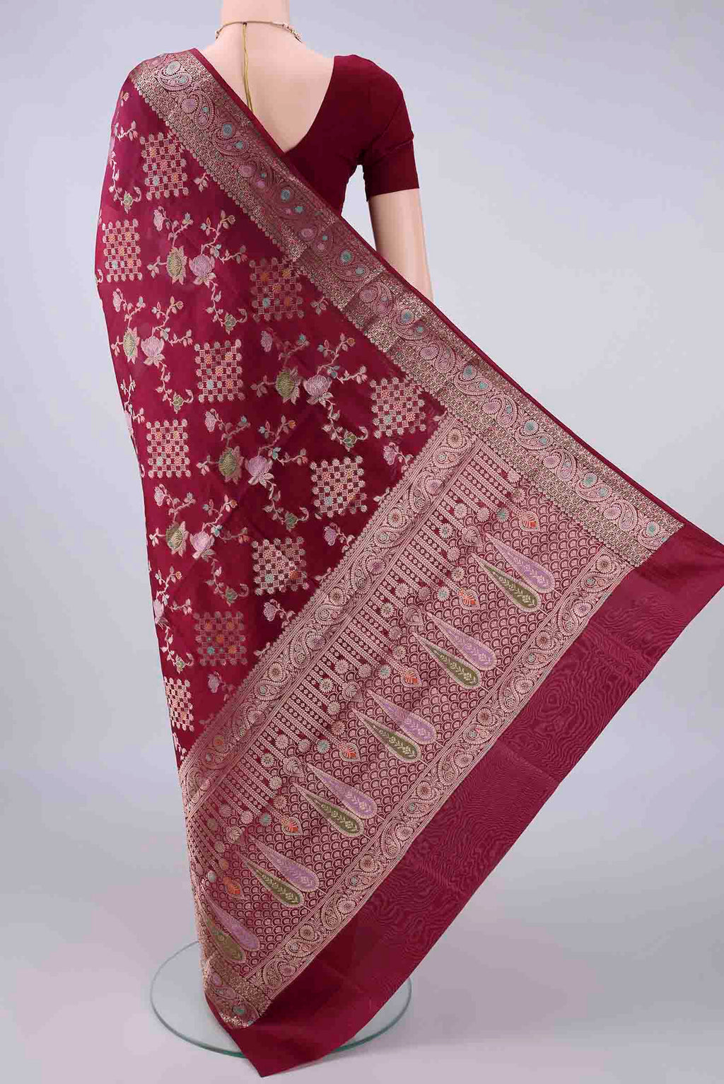 Flat view of Pure Silk Maroon Banarasi Raw Saree with Zari Brocade on the body and Zari Border. 