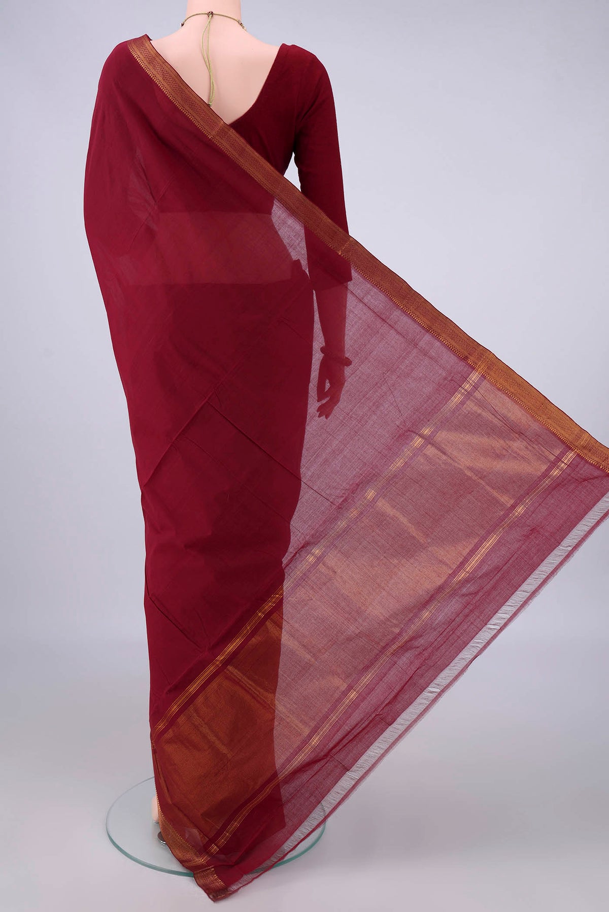 Flat view of Maroon Mangalagiri Cotton Saree with Plain Body and Zari Border. 
