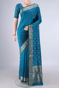 Pure Silk Blue Banarasi Katan Saree with Zari Butta on the body and Zari Border.  displayed on a mannequin