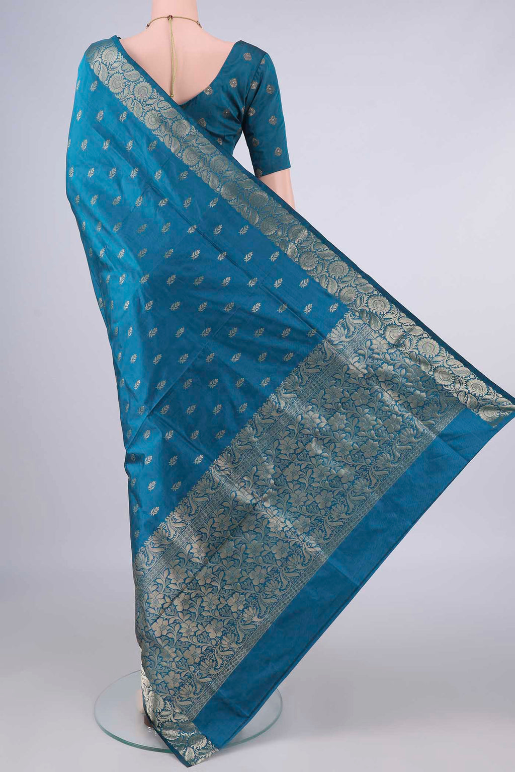 Flat view of Pure Silk Blue Banarasi Katan Saree with Zari Butta on the body and Zari Border. 