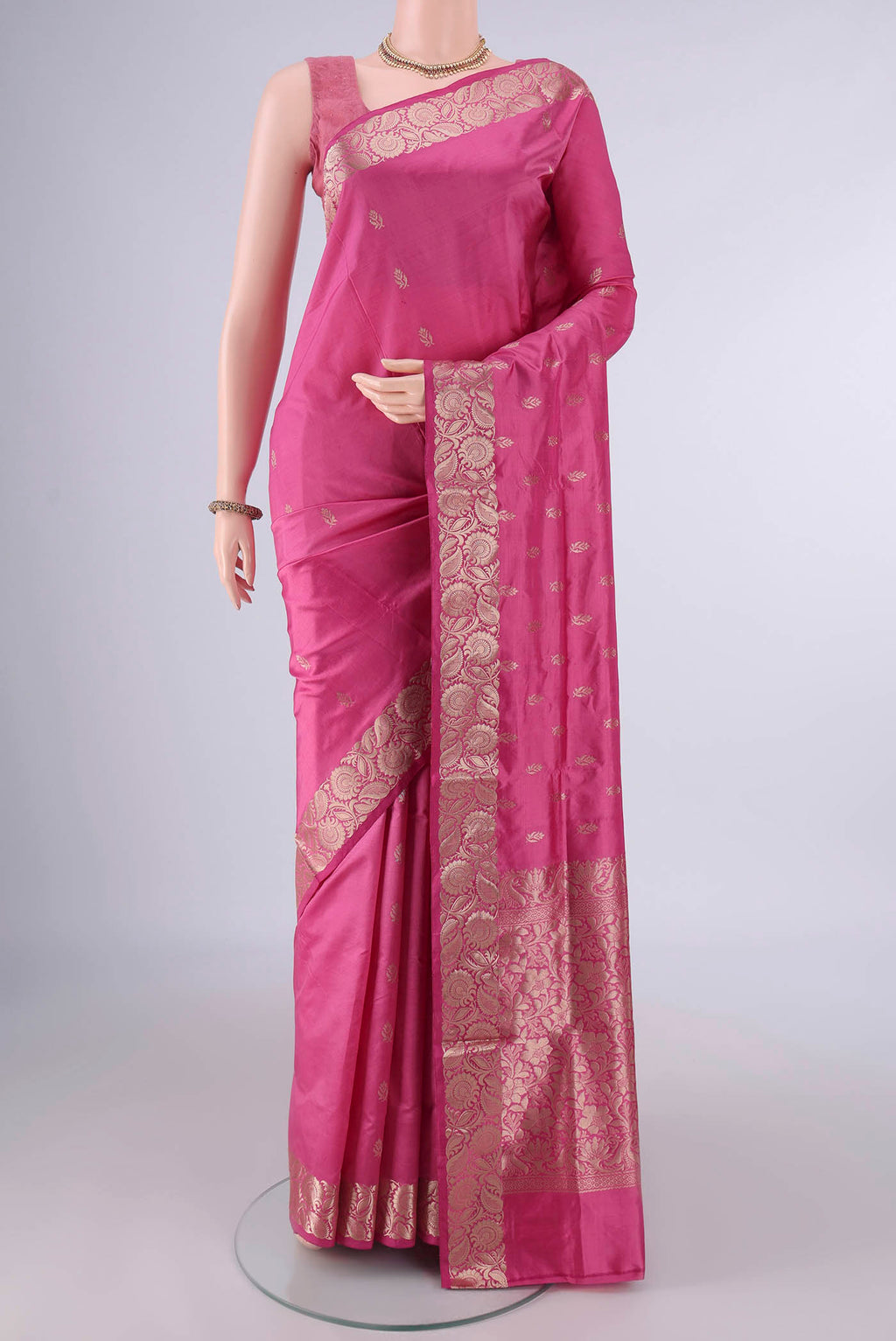 Pure Silk Pink Banarasi Katan Saree with Zari Butta on the body and Zari Border.  displayed on a mannequin