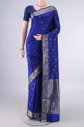 Pure Silk Royal Blue Banarasi Katan Saree with Zari Butta on the body and Zari Border.  displayed on a mannequin