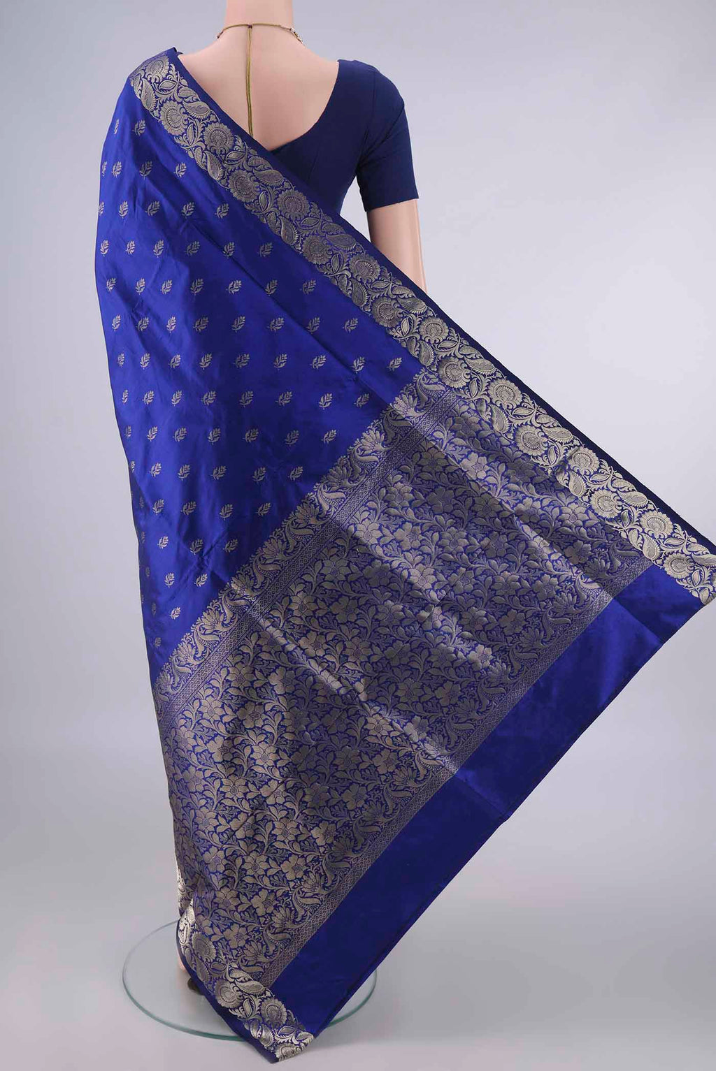 Flat view of Pure Silk Royal Blue Banarasi Katan Saree with Zari Butta on the body and Zari Border. 