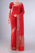 Pure Silk Red Banarasi Katan Saree with Zari Butta on the body and Zari Border.  displayed on a mannequin