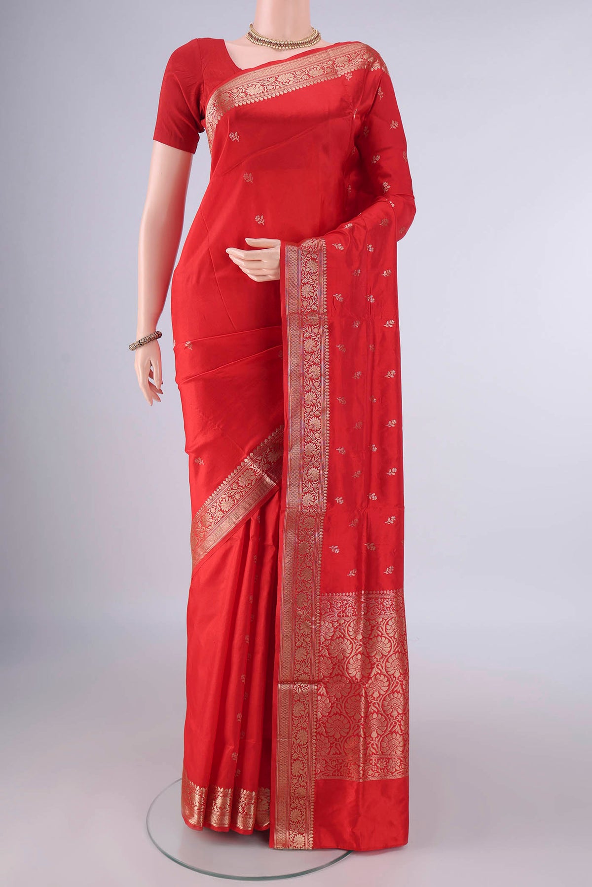 Pure Silk Red Banarasi Katan Saree with Zari Butta on the body and Zari Border.  displayed on a mannequin