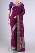 Pure Silk Burgundy Banarasi Katan Saree with Zari Butta on the body and Zari Border.  displayed on a mannequin
