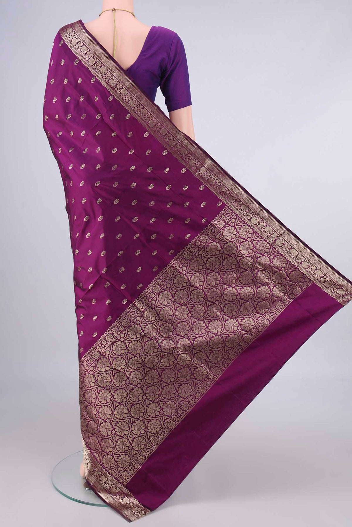 Flat view of Pure Silk Burgundy Banarasi Katan Saree with Zari Butta on the body and Zari Border. 