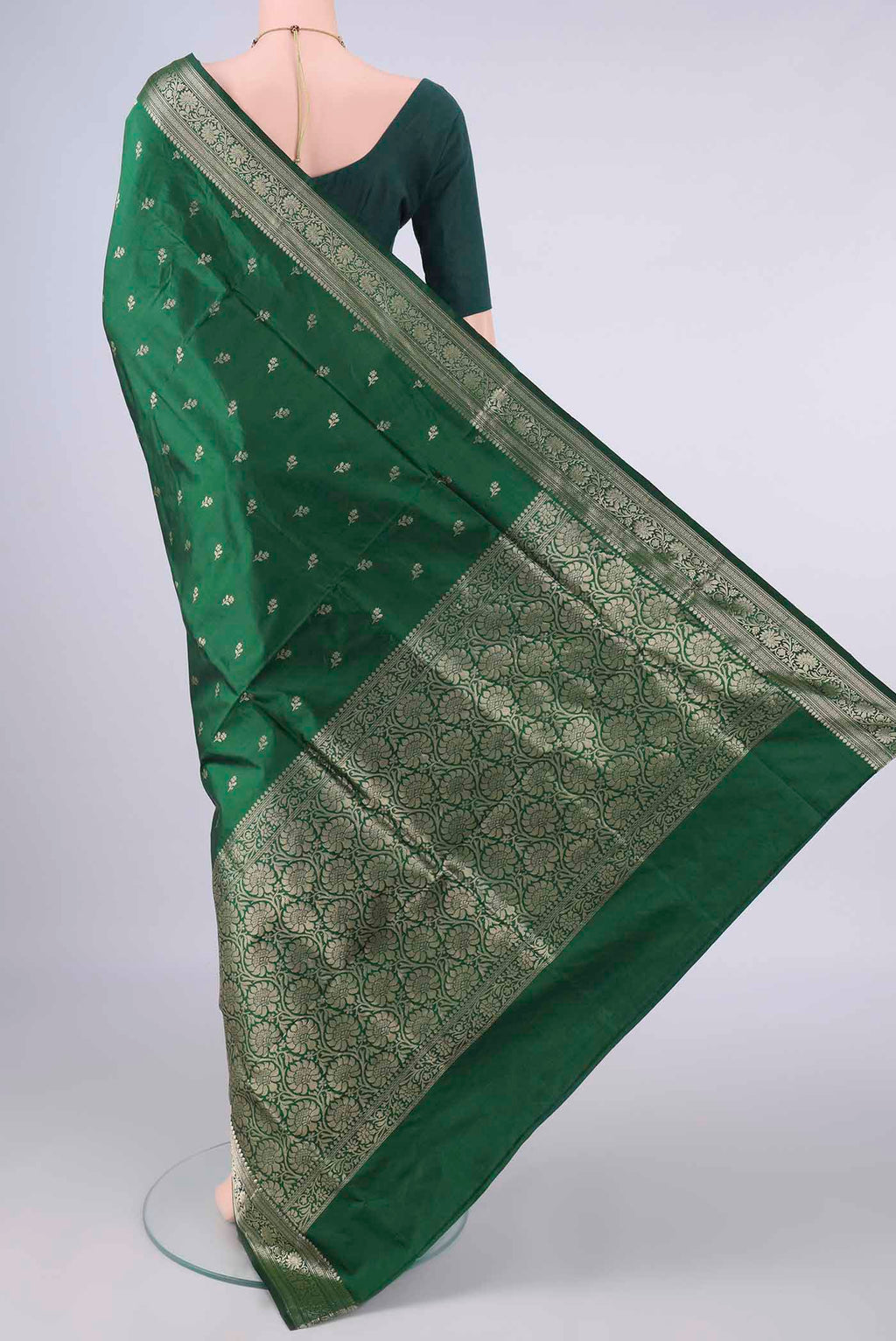Flat view of Pure Silk Bottle Green Banarasi Katan Saree with Zari Butta on the body and Zari Border. 