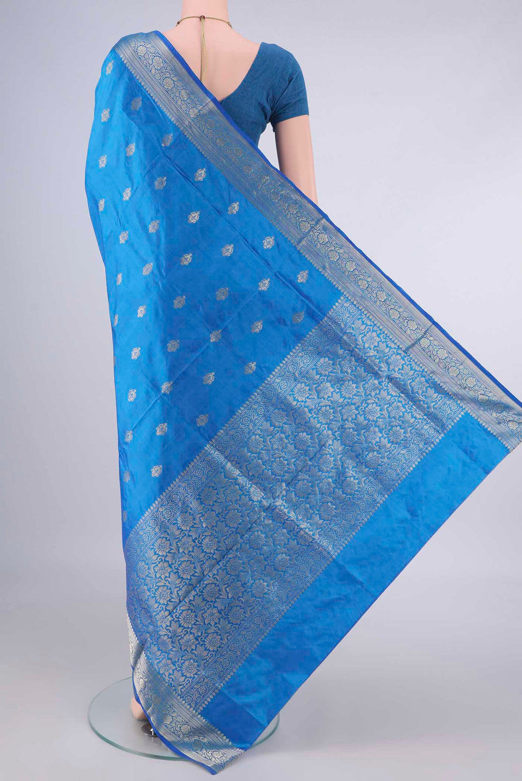Flat view of Pure Silk Electric Blue Banarasi Katan Saree with Zari Butta on the body and Zari Border. 