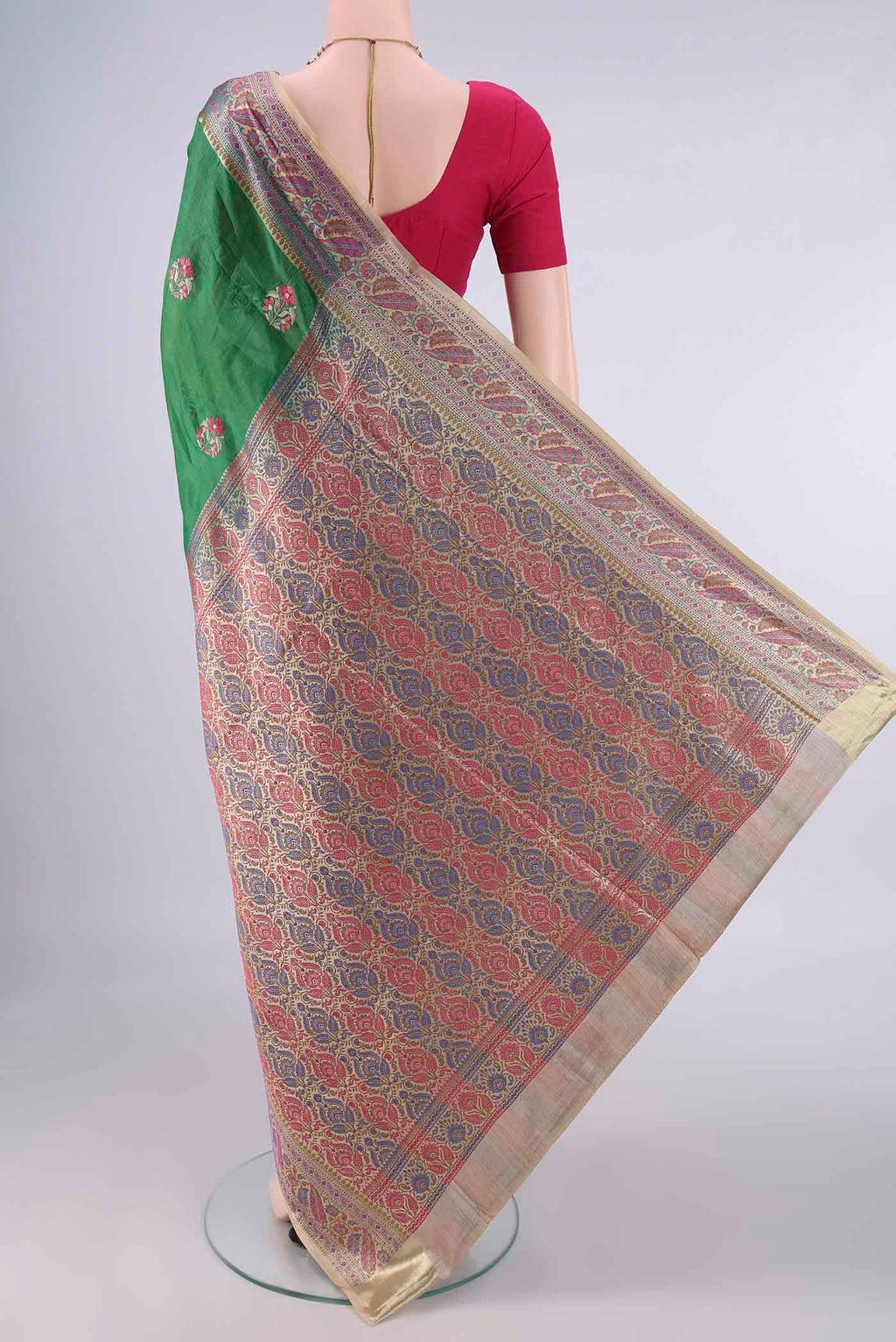 Flat view of Green Banarasi Tussar Saree with Embroidery on the body and Zari Border. 