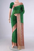 Green Banarasi Tussar Saree with Plain Body and Zari Border.  displayed on a mannequin