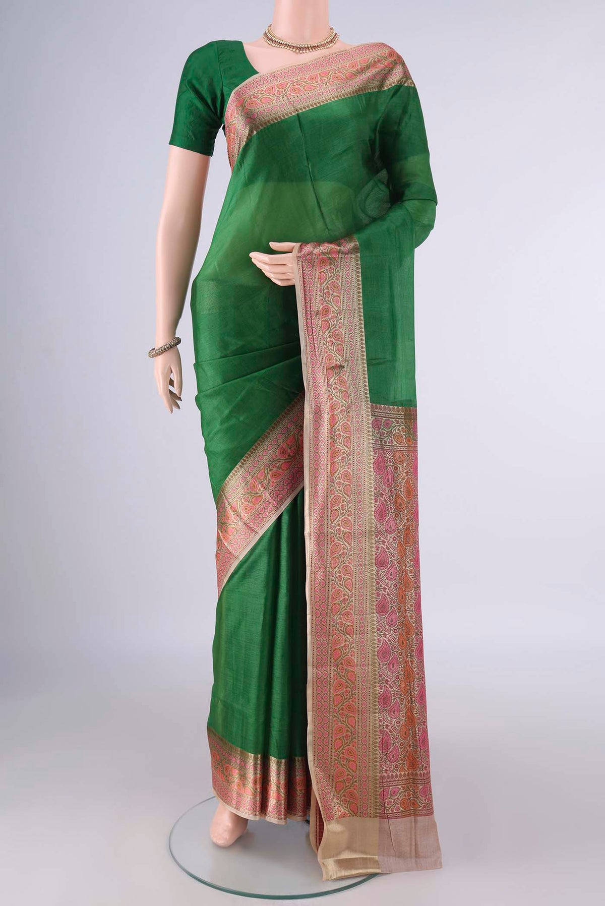 Green Banarasi Tussar Saree with Plain Body and Zari Border.  displayed on a mannequin