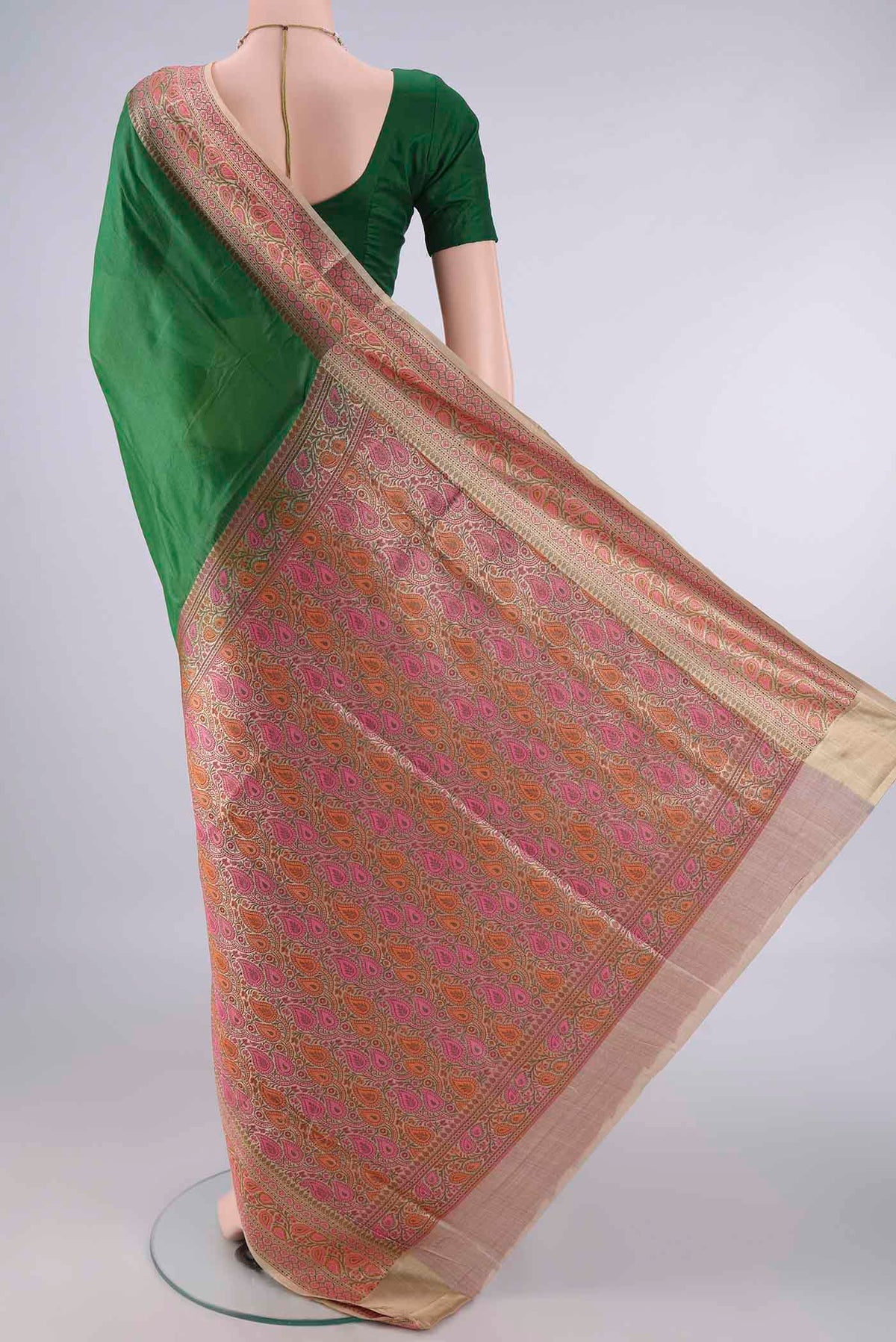 Flat view of Green Banarasi Tussar Saree with Plain Body and Zari Border. 