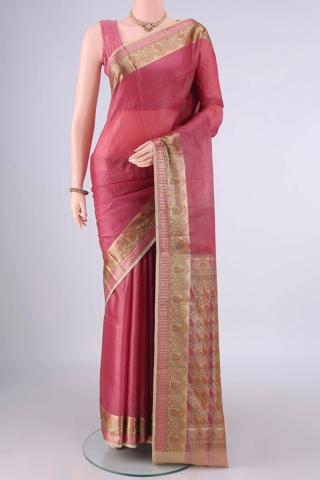 Peach Banarasi Tussar Saree with Plain Body and Zari Border.  displayed on a mannequin