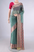Light Green Banarasi Tussar Saree with Plain Body and Zari Border.  displayed on a mannequin