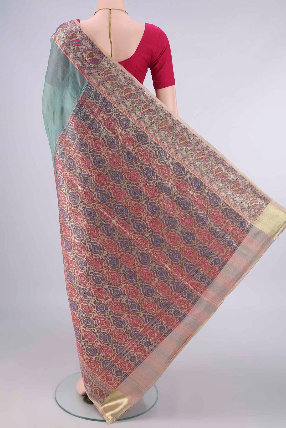 Flat view of Light Green Banarasi Tussar Saree with Plain Body and Zari Border. 