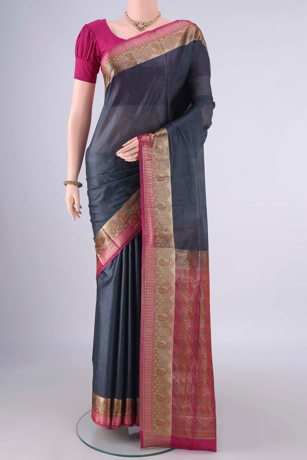 Davys Grey Banarasi Tussar Saree with Plain Body and Zari Border.  displayed on a mannequin