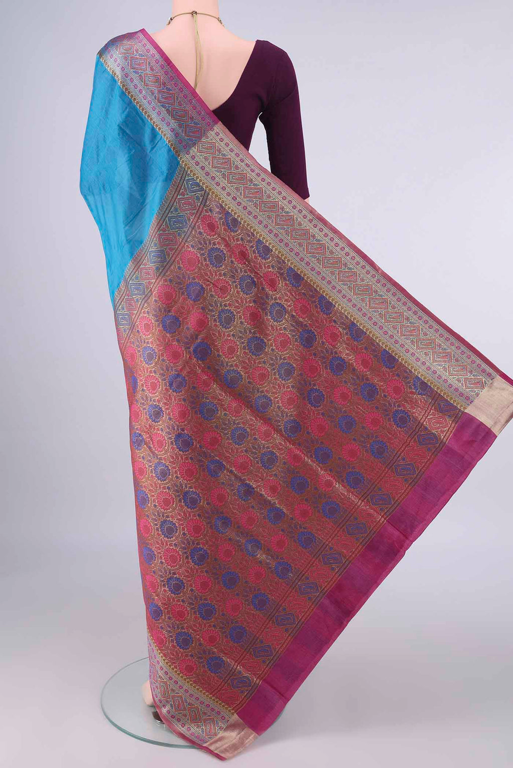 Flat view of Blue Banarasi Tussar Saree with Plain Body and Zari Border. 