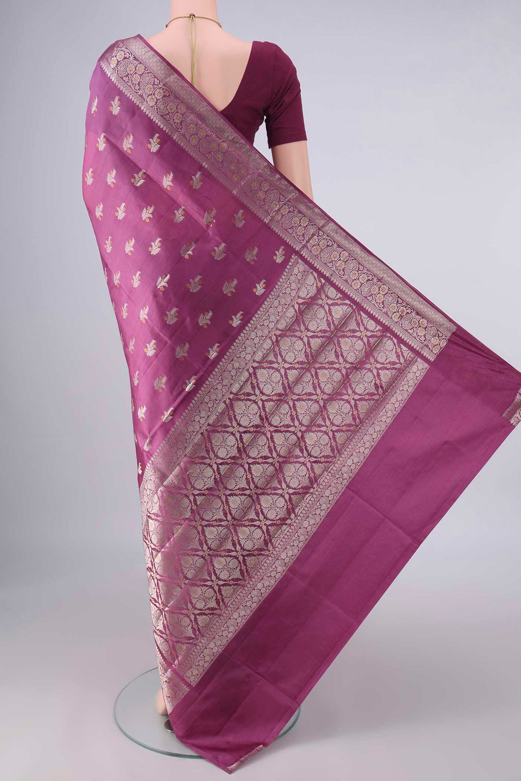 Flat view of Pure Silk Mauve Banarasi Raw Saree with Zari And Thread Butta on the body and Zari Border. 