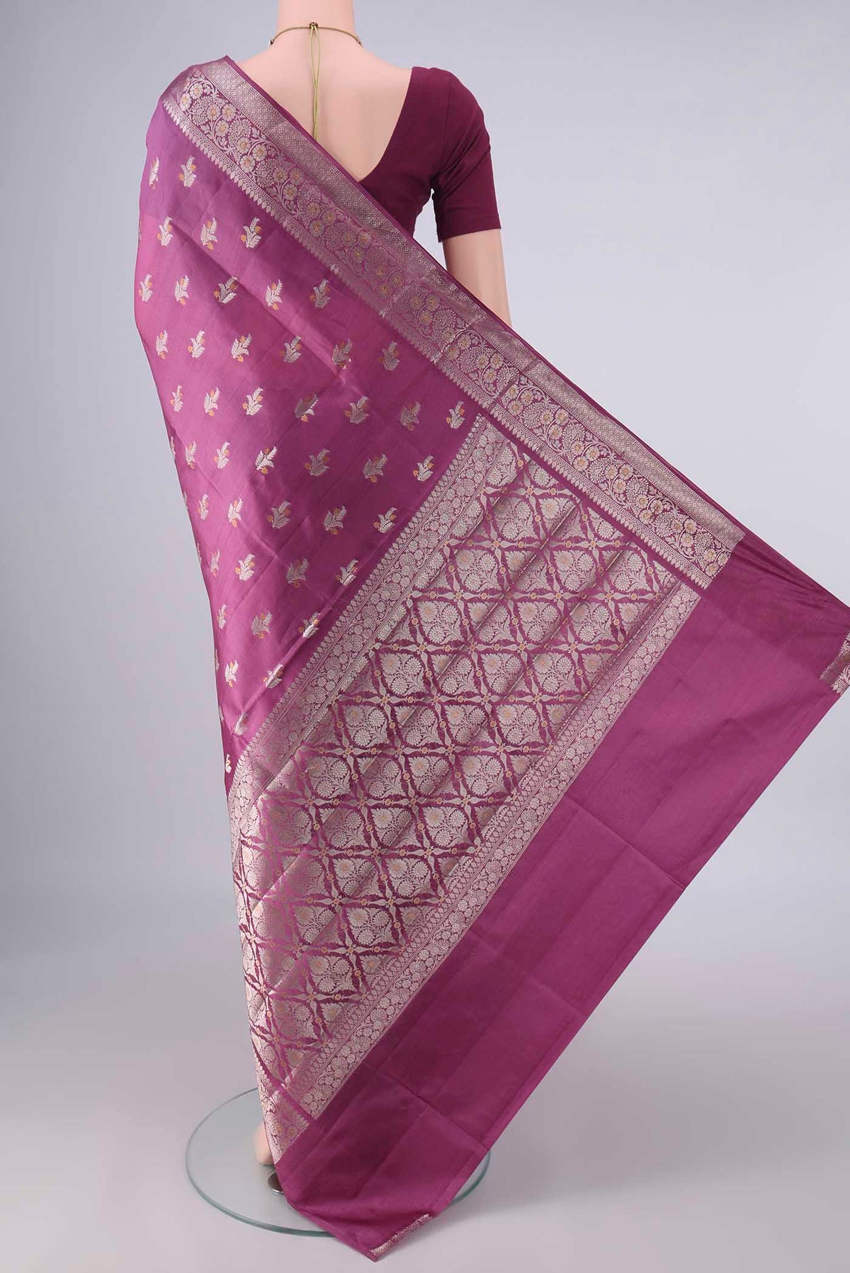 Flat view of Pure Silk Mauve Banarasi Raw Saree with Zari And Thread Butta on the body and Zari Border. 