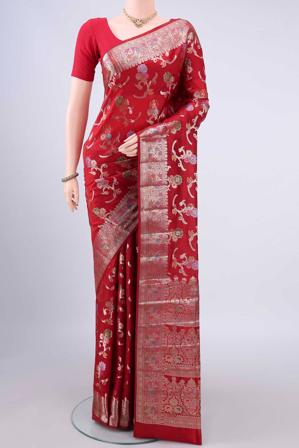 Pure Silk Red Banarasi Raw Saree with Zari And Thread Butta on the body and Zari Border.  displayed on a mannequin