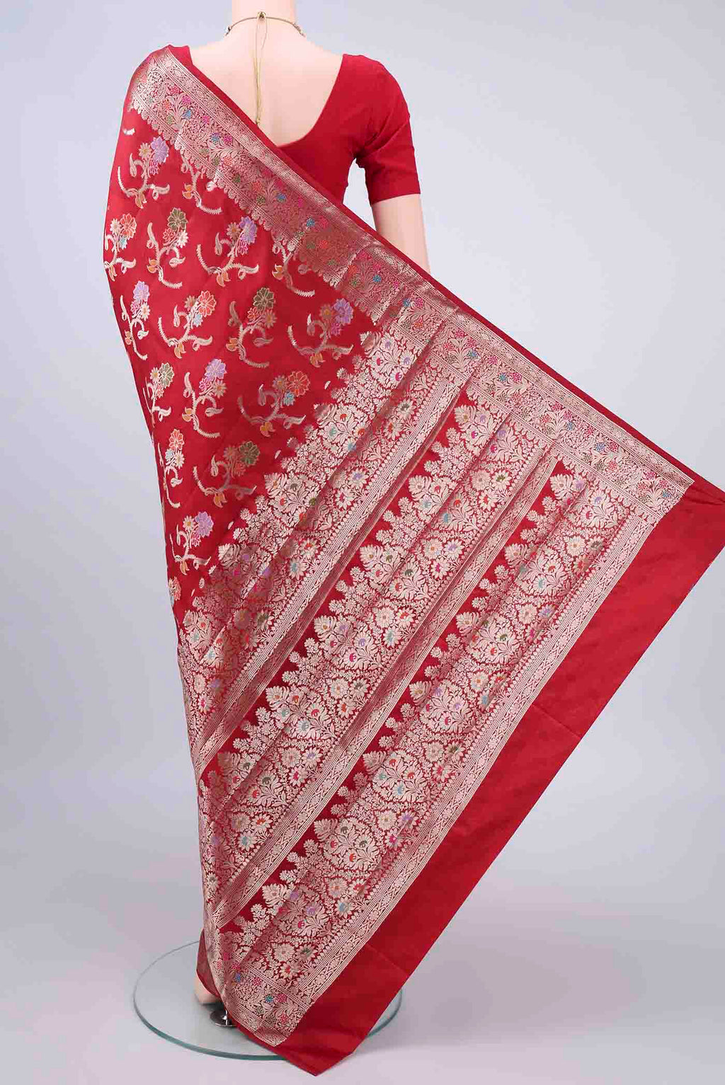 Flat view of Pure Silk Red Banarasi Raw Saree with Zari And Thread Butta on the body and Zari Border. 