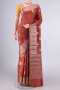 Pure Silk Rust Banarasi Raw Saree with Zari Butta on the body and Zari Border.  displayed on a mannequin