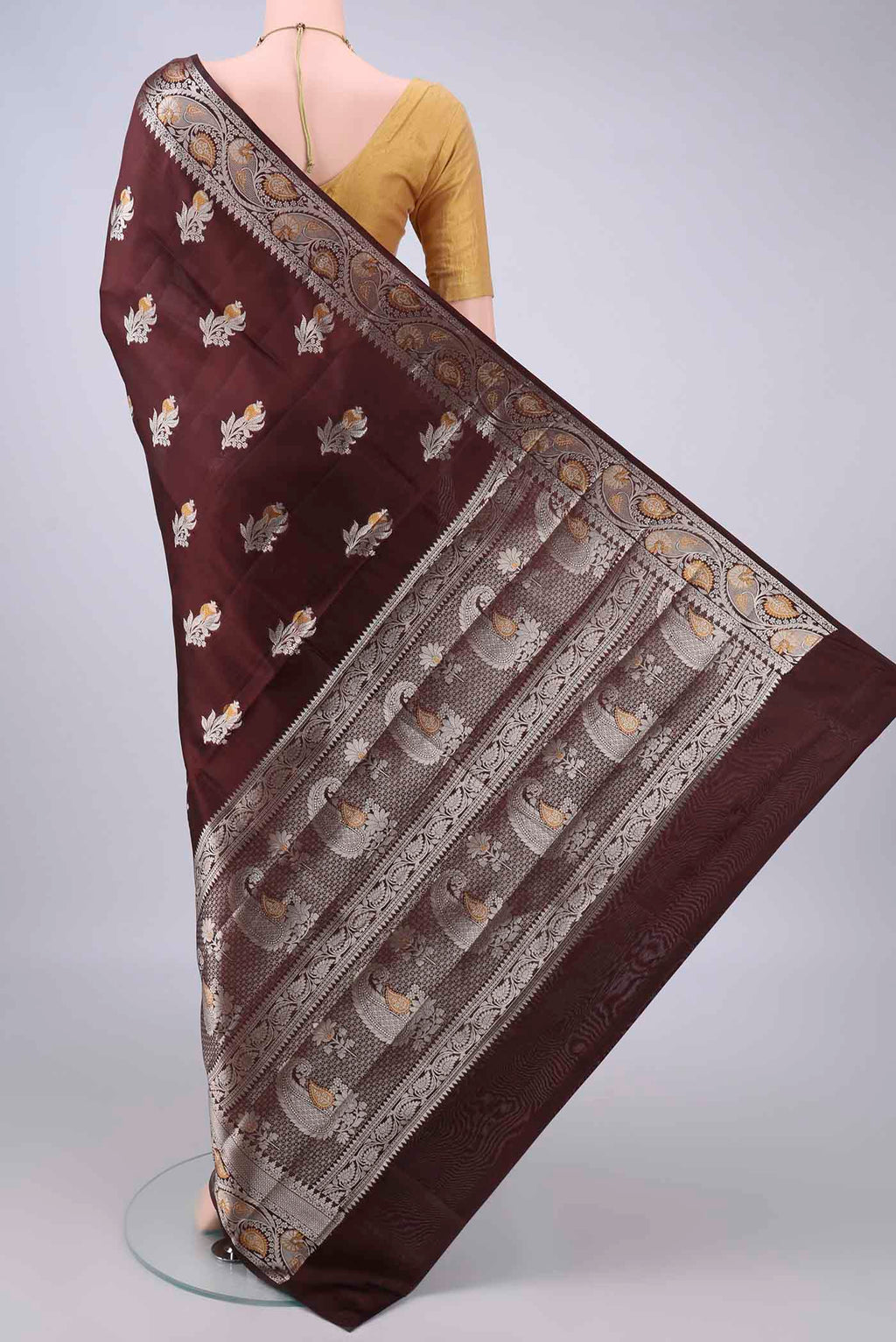 Flat view of Pure Silk Brown Banarasi Raw Saree with Zari Butta on the body and Zari Border. 