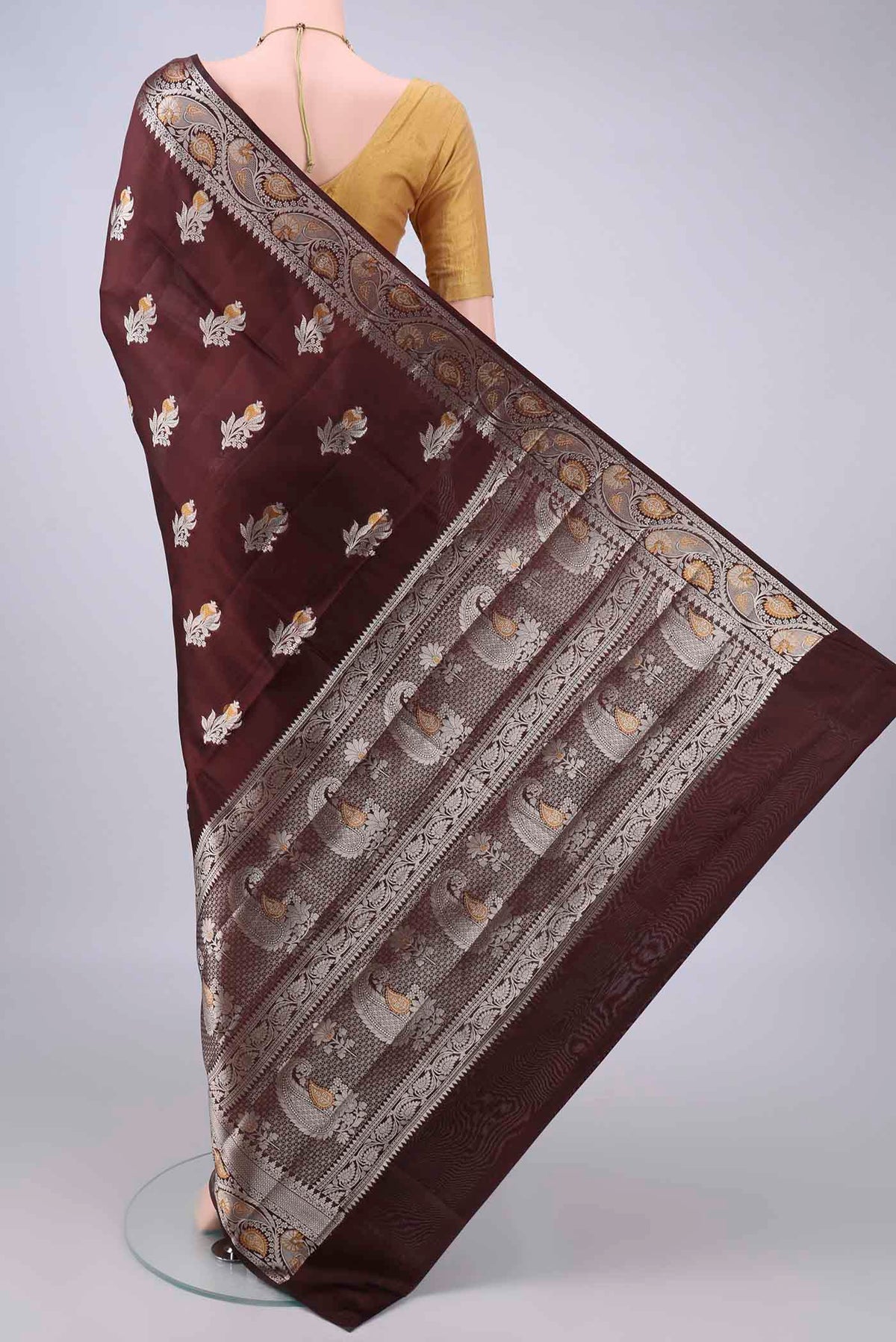 Flat view of Pure Silk Brown Banarasi Raw Saree with Zari Butta on the body and Zari Border. 