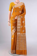 Pure Silk Mustard Banarasi Raw Saree with Zari And Thread Butta on the body and Zari Border.  displayed on a mannequin