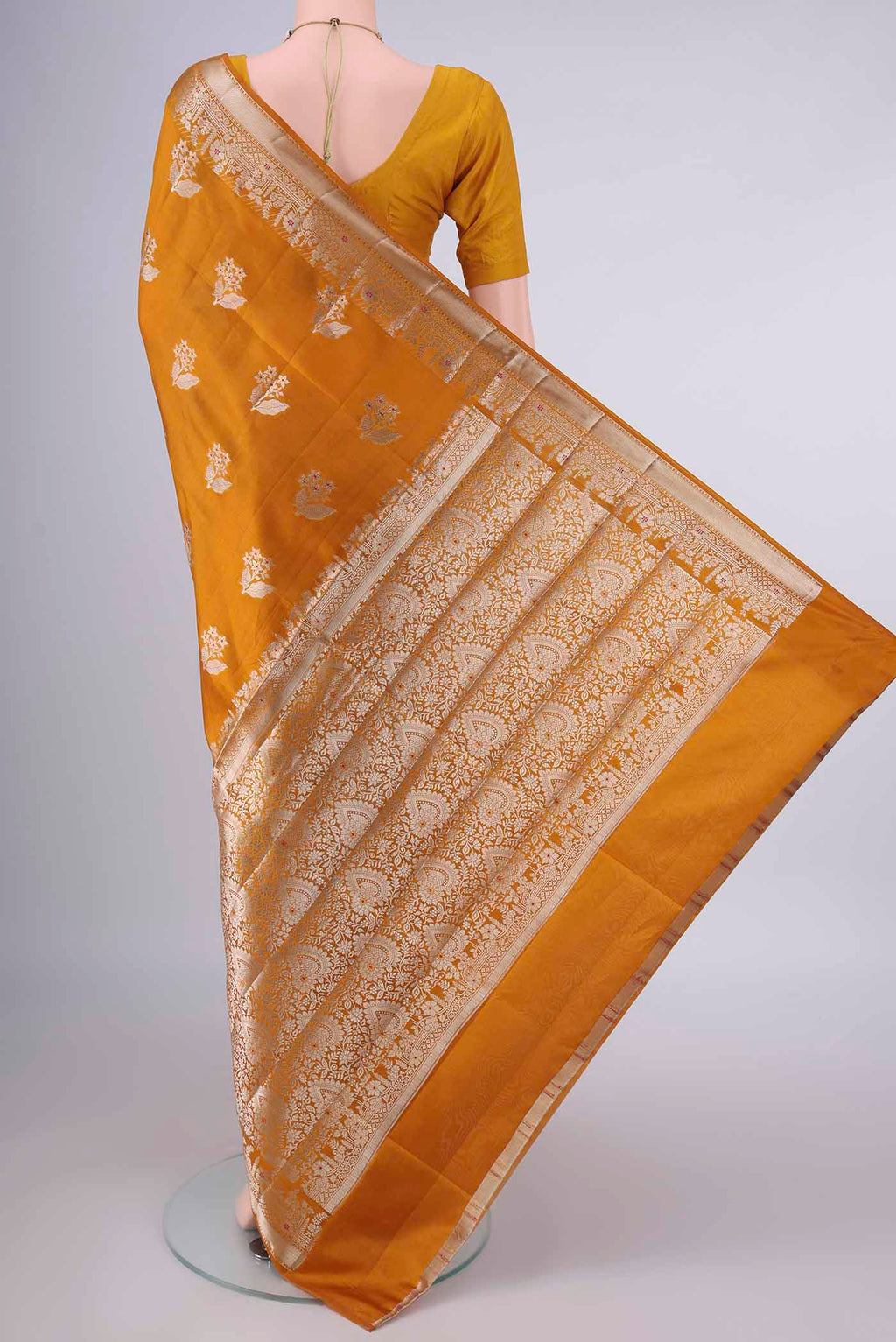 Flat view of Pure Silk Mustard Banarasi Raw Saree with Zari And Thread Butta on the body and Zari Border. 