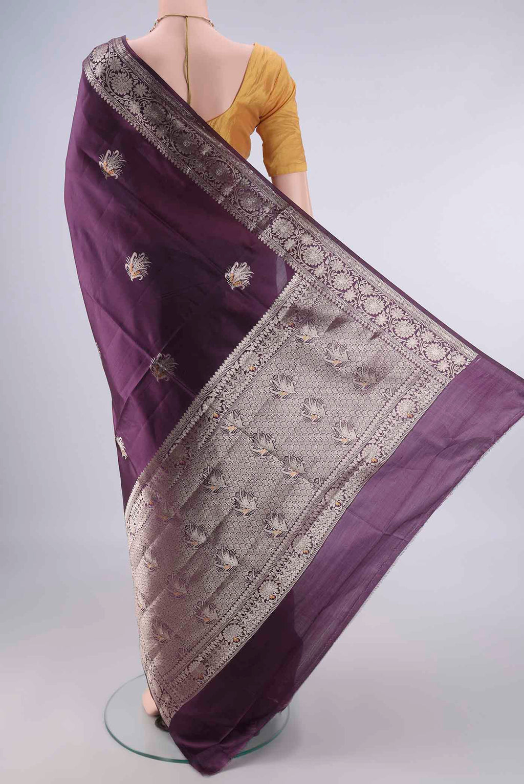 Flat view of Pure Silk Purple Banarasi Raw Saree with Zari Butta on the body and Zari Border. 