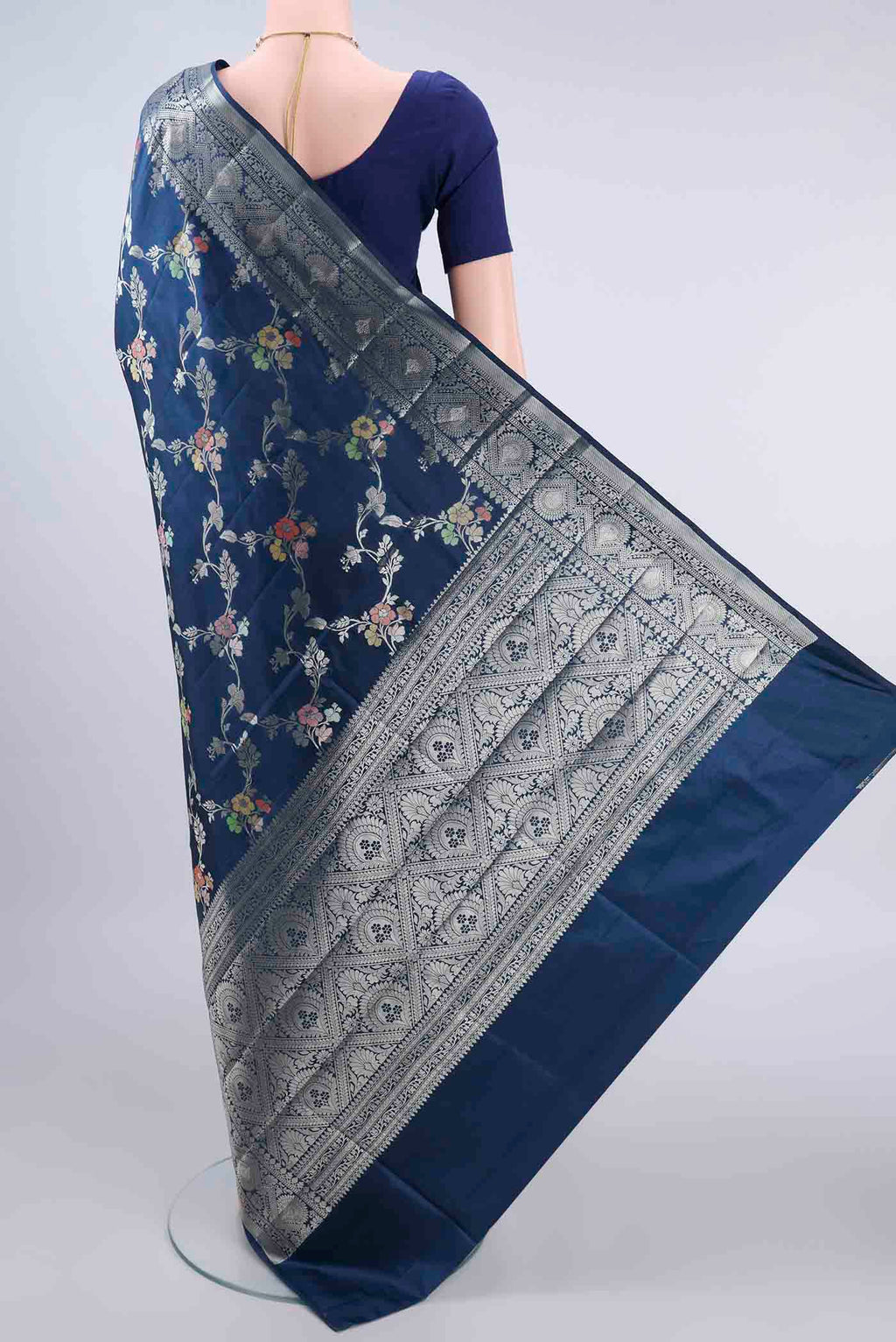 Flat view of Pure Silk Blue Banarasi Raw Saree with Zari And Thread Butta on the body and Zari Border. 