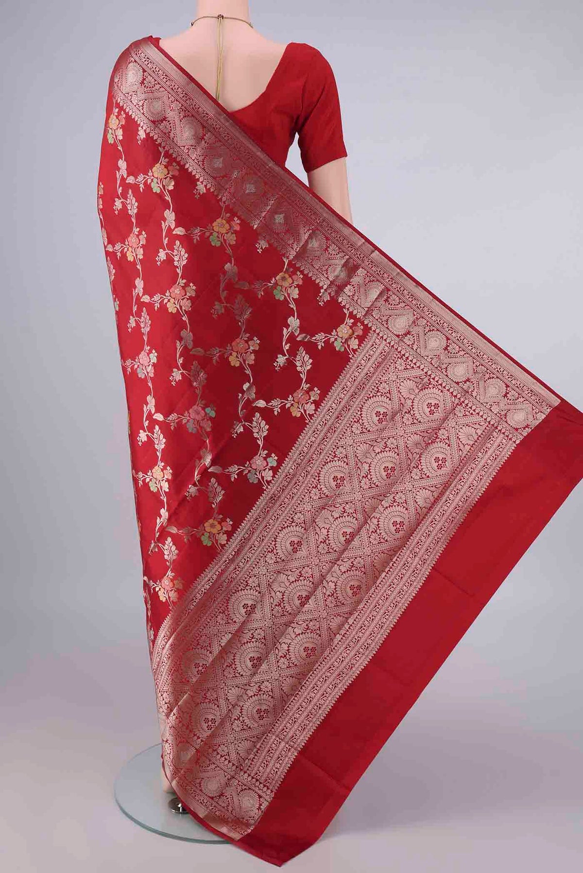 Flat view of Pure Silk Red Banarasi Raw Saree with Zari And Thread Butta on the body and Zari Border. 