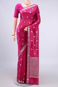 Pure Silk Dark Pink Banarasi Raw Saree with Zari And Thread Butta on the body and Zari Border.  displayed on a mannequin